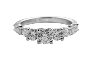 THREE STONE DIAMOND RING WITH DIAMONDS DOWN THE SHANK